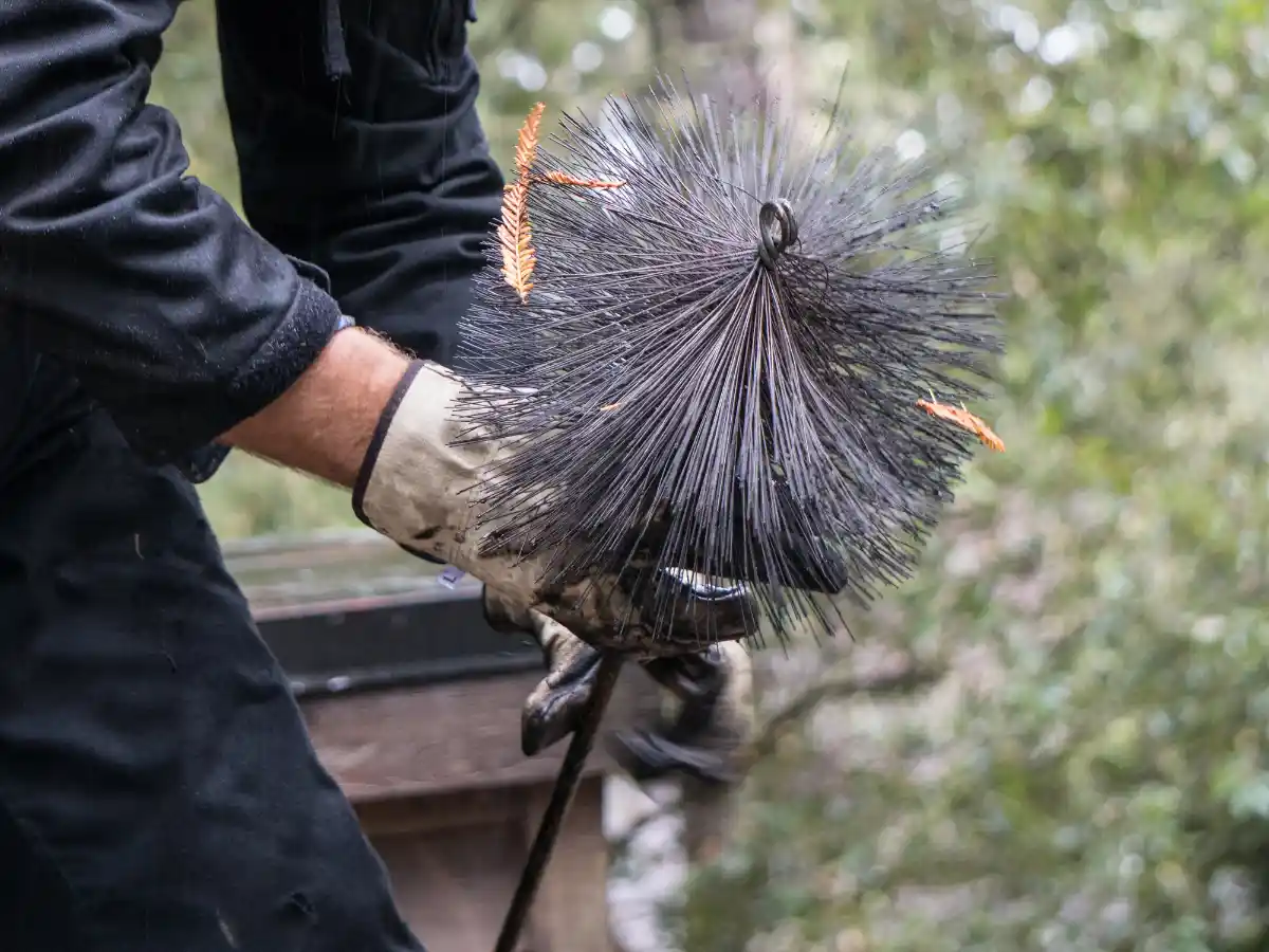 Clearing soot from a chimney flue