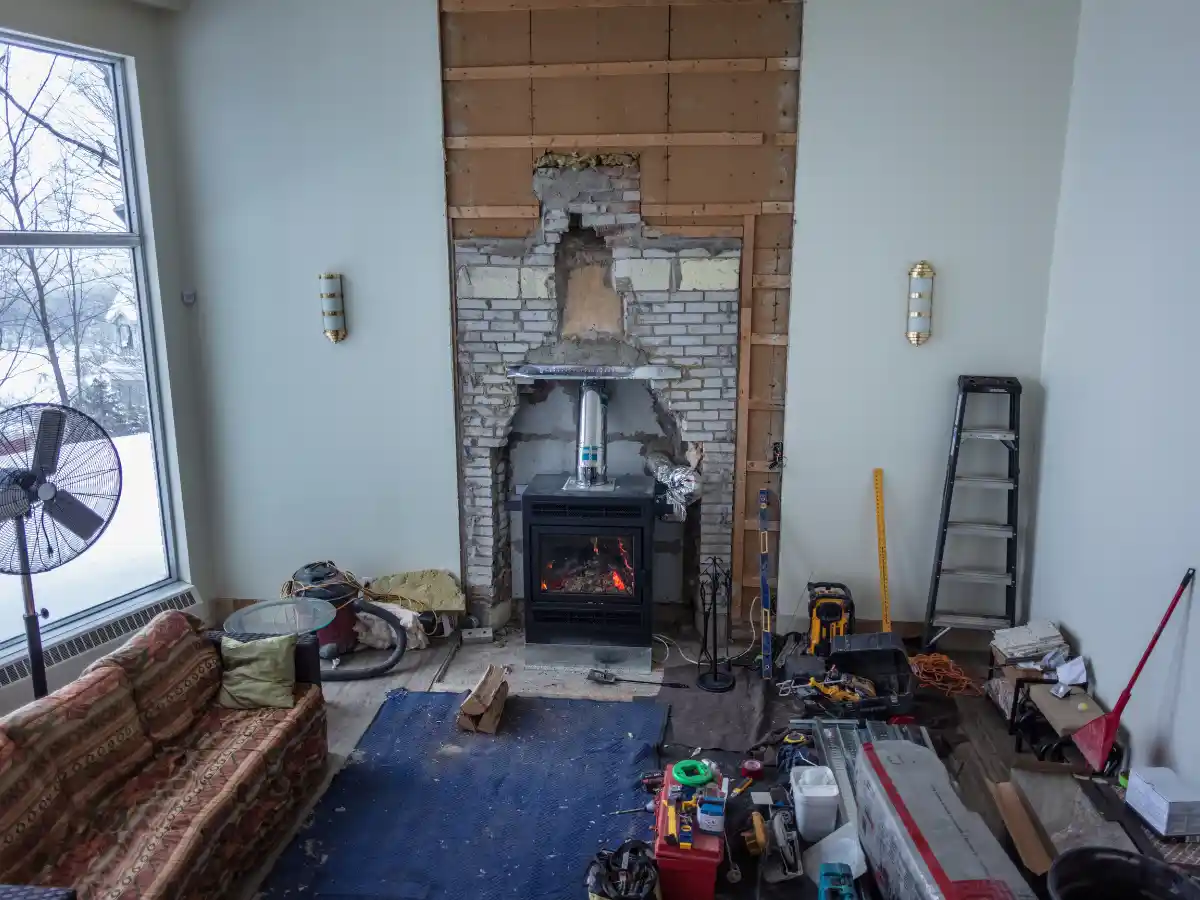 Wood stove being cleaned out