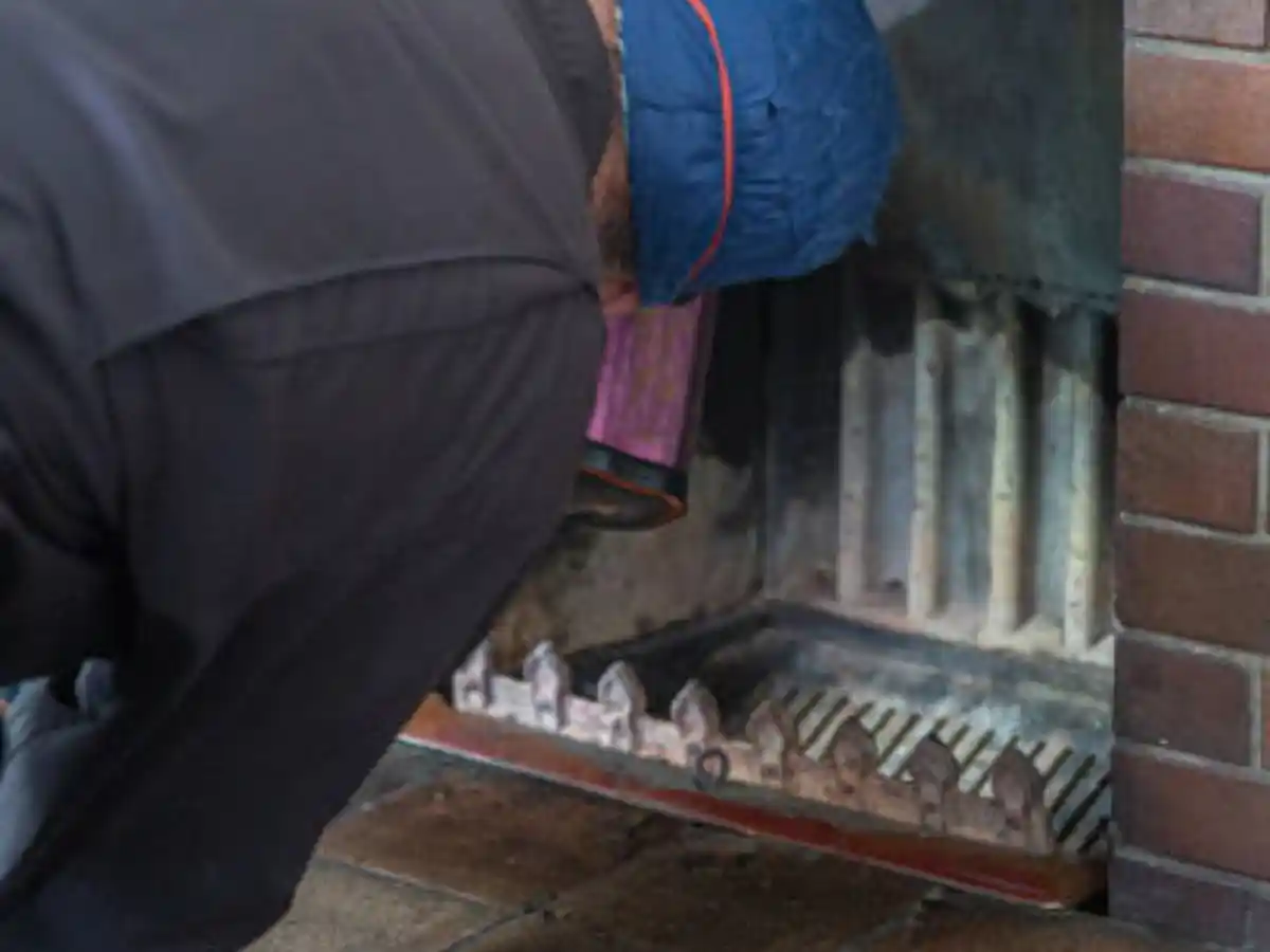 Wood stove being cleaned out